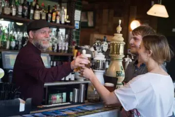 Joby handing over pint