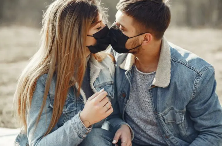 Couple kissing masks