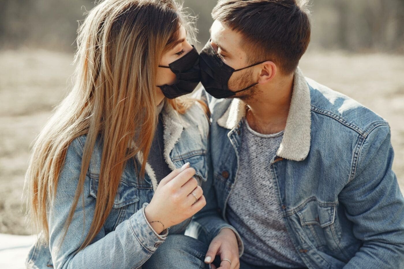 Couple kissing masks
