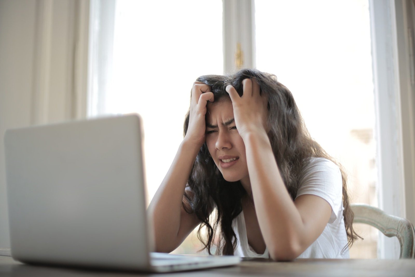 Photo by Andrea Piacquadio: https://www.pexels.com/photo/woman-in-white-shirt-showing-frustration-3807738/